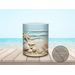 Close-up of ceramic mug featuring vibrant seashells and sand.
